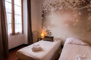 Postel nebo postele na pokoji v ubytování Ma Petite Auberge