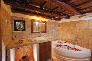 a bathroom with a tub and a sink at Strofilia Villas Crete in Sellía +63 photos