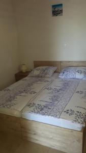 Postel nebo postele na pokoji v ubytování Apartments Babić