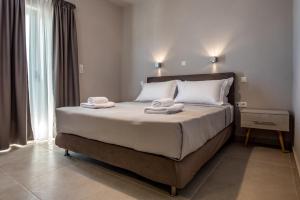 Postel nebo postele na pokoji v ubytování Asteri Apartments und Studios