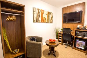 A television and/or entertainment centre at Trivelles Gatwick Hotel & airport Parking