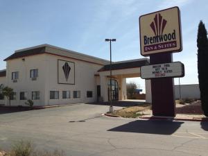 a sign in front of a texas suites building at Brentwood Inn & Suites in Hobbs