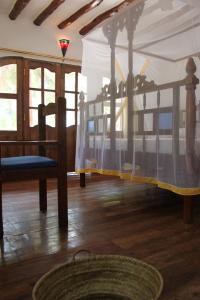a bedroom with two bunk beds in a room at Panga Chumvi Beach Resort in Matemwe