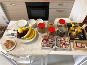 a table with a bunch of food and fruit on it at La casa del Moro in Sabaudia