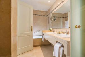 a bathroom with a sink and a shower at Hotel Santa Marta in Lloret de Mar