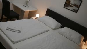 Voodi või voodid majutusasutuse Hotel Bílý Koníček toas