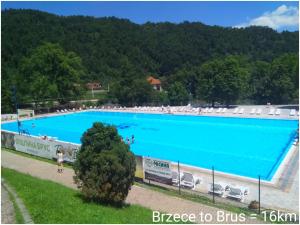 a large swimming pool with a large blue pool at KOPAONIK-GONDOLA 100m in Brzeće