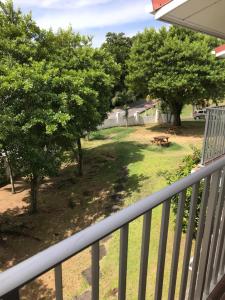 a view of a yard from the balcony of a house at Michel Holiday Apartments in Victoria