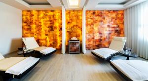 a room with two beds and a brick wall at Airport Hotel Okęcie in Warsaw
