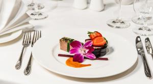 a white plate with a dessert on a table at Airport Hotel Okęcie in Warsaw