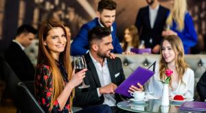 a group of people sitting at a table in a restaurant at Airport Hotel Okęcie in Warsaw
