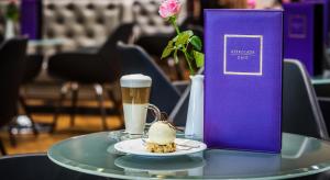 a table with a plate of food and a drink at Airport Hotel Okęcie in Warsaw