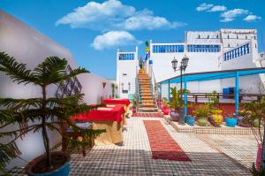 a building with a staircase in front of it at Riad Dar Jabador in Sale