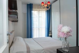 Posteľ alebo postele v izbe v ubytovaní Fellini - Family Flat