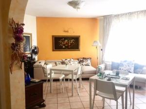 a living room with a couch and a table at B&B A casa di Rosi in Porto Recanati