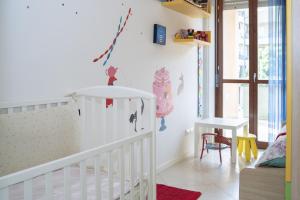 Posteľ alebo postele v izbe v ubytovaní Fellini - Family Flat