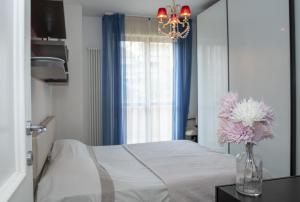Posteľ alebo postele v izbe v ubytovaní Fellini - Family Flat