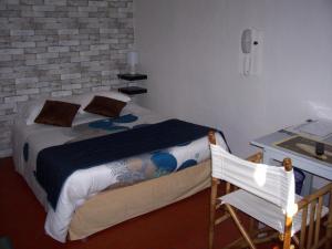 Postel nebo postele na pokoji v ubytování Auberge Cocagne