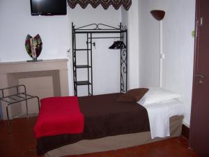 Ein Bett oder Betten in einem Zimmer der Unterkunft Auberge Cocagne