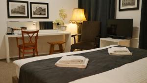 Voodi või voodid majutusasutuse Hotel Bílý Koníček toas