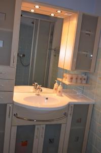 a bathroom with a sink and a mirror at Fewo Kuhlmann in Willingen