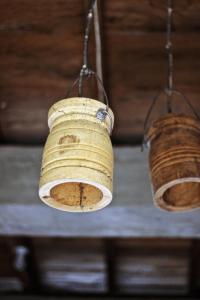 two baskets hanging from the ceiling of a building at Waterstone Guesthouse in Bukit Lawang