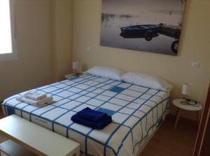A bed or beds in a room at Zamora Apartments