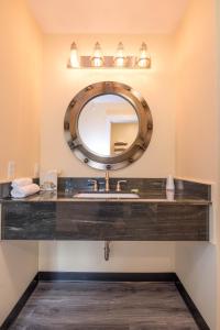 a bathroom with a mirror and a sink at The Inn on Mount Desert in Bar Harbor