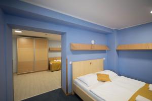 Postel nebo postele na pokoji v ubytování S Hotel
