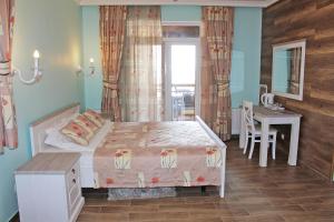 a bedroom with a bed and a table and a desk at Marseille Resort in Zatoka +27 photos