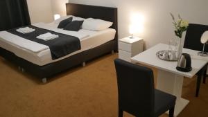Voodi või voodid majutusasutuse Hotel Bílý Koníček toas