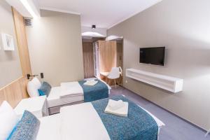 Posteľ alebo postele v izbe v ubytovaní Hotel Falcon