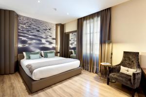 A bed or beds in a room at Hotel Condes de Barcelona