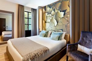 A bed or beds in a room at Hotel Condes de Barcelona