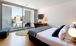 A bed or beds in a room at Hotel Condes de Barcelona