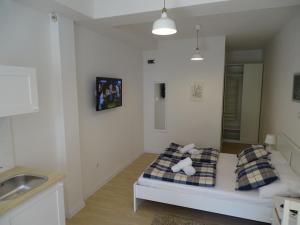 Posteľ alebo postele v izbe v ubytovaní Job studio apartments