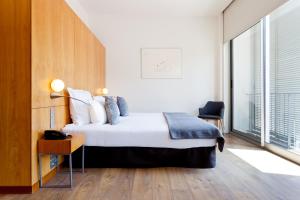 A bed or beds in a room at Hotel Condes de Barcelona