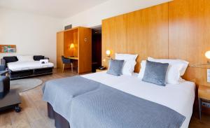 A bed or beds in a room at Hotel Condes de Barcelona