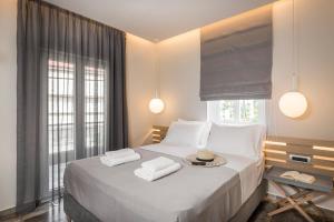 Posteľ alebo postele v izbe v ubytovaní Sun Ray Luxury Apartments