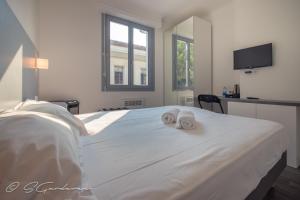 Le Matisse Pau Centre tesisinde bir odada yatak veya yataklar