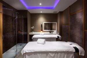Postel nebo postele na pokoji v ubytování Gran Tacande Wellness & Relax Costa Adeje