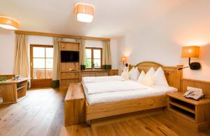 Posteľ alebo postele v izbe v ubytovaní Wellness & Sporthotel Alpenhof
