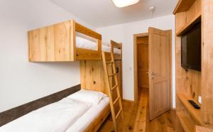 Posteľ alebo postele v izbe v ubytovaní Wellness & Sporthotel Alpenhof