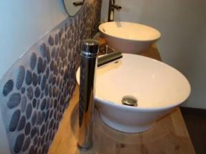 a bathroom with a white sink and a toilet at LB et LB in Beaune