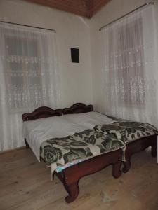 Cama ou camas em um quarto em Erasti Guesthouse
