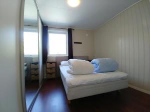 A bed or beds in a room at Sjøholt Camping