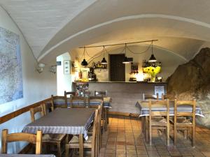 a restaurant with wooden tables and chairs and a counter at Santuario De Bellmunt in Sant Pere de Torelló +84 photos