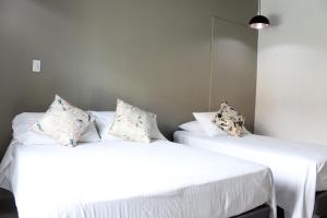 Postel nebo postele na pokoji v ubytování Hotel Boutique Plaza