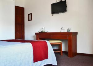 TV a/nebo společenská místnost v ubytování Hotel Campestre Inn
