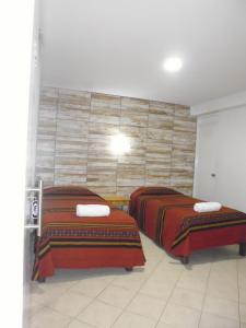 Cama o camas de una habitación en Hostal Fatima